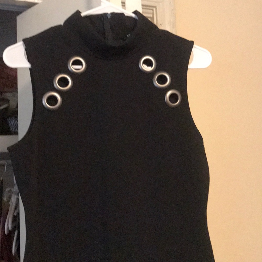 Form fitting black dress . Very elegant